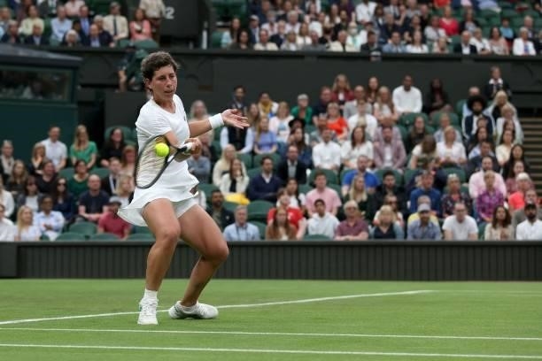 Spain's Carla Suarez Navarro returns against Australia's Ashleigh Barty during their women's singles first round match on the second day of the 2021...