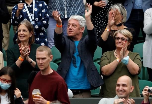 Former Speaker of Britain's House of Commons, John Bercow applauds on Centre Court ahead of the men's singles first round match between Switzerland's...