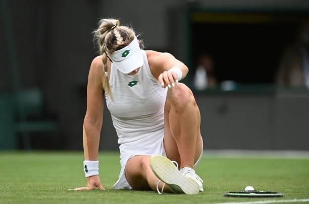 Germany's Angelique Kerber slips during play against Serbia's Nina Stojanovic during their women's singles first round match on the second day of the...