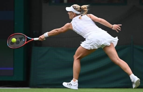 Germany's Angelique Kerber lunges for a return to Serbia's Nina Stojanovic during their women's singles first round match on the second day of the...