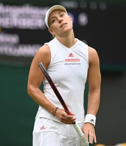 Germany's Angelique Kerber loses a point to Serbia's Nina Stojanovic during their women's singles first round match on the second day of the 2021...
