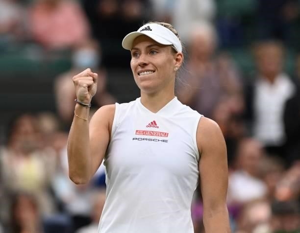 Germany's Angelique Kerber celebrates her win against Serbia's Nina Stojanovic during their women's singles first round match on the second day of...