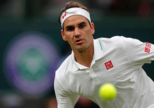 Switzerland's Roger Federer eyes the ball to play a return against France's Adrian Mannarino during their men's singles first round match on the...