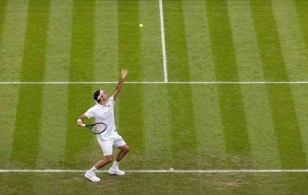 Switzerland's Roger Federer serves against France's Adrian Mannarino during their men's singles first round match on the second day of the 2021...