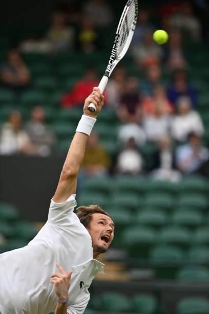 Russia's Daniil Medvedev serves to Germany's Jan-Lennard Struff during their men's singles first round match on the second day of the 2021 Wimbledon...