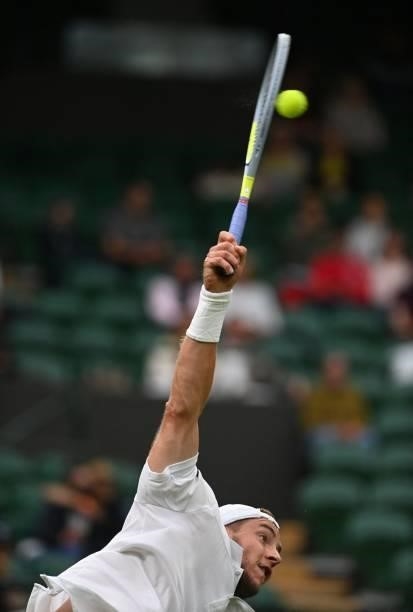 Germany's Jan-Lennard Struff serves to Russia's Daniil Medvedev during their men's singles first round match on the second day of the 2021 Wimbledon...