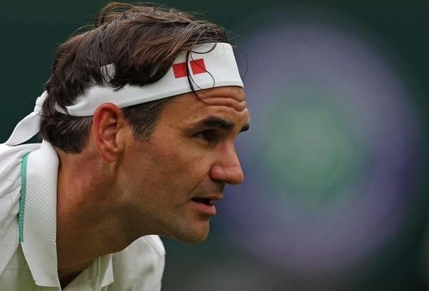 Switzerland's Roger Federer plays against France's Adrian Mannarino during their men's singles first round match on the second day of the 2021...
