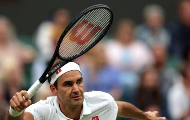 Switzerland's Roger Federer returns against France's Adrian Mannarino during their men's singles first round match on the second day of the 2021...