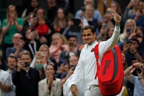 Switzerland's Roger Federer waves to the fans as he leaves the court after winning against France's Adrian Mannarino during their men's singles first...