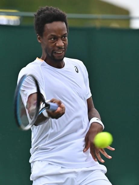 France's Gael Monfils returns to Australia's Christopher O'Connell during their men's singles first round match on the second day of the 2021...