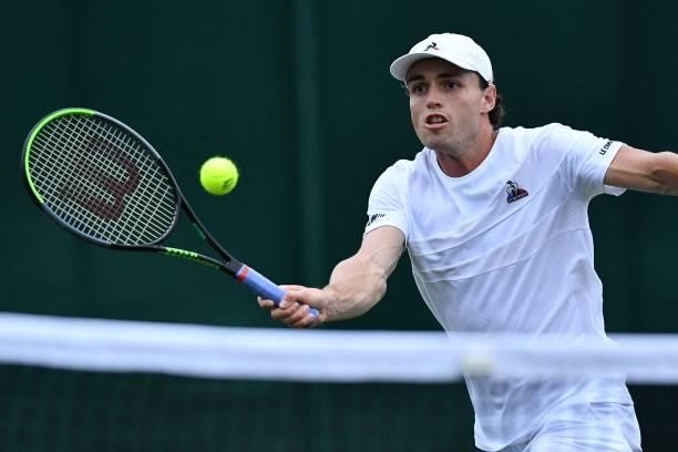 Australia's Christopher O'Connell returns to France's Gael Monfils during their men's singles first round match on the second day of the 2021...