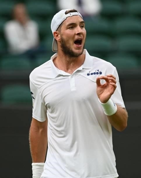Germany's Jan-Lennard Struff celebrates a point against Russia's Daniil Medvedev during their men's singles first round match on the second day of...