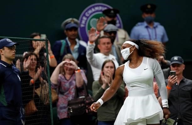Player Serena Williams wearing a face covering to combat the spread of coronavirus, leaves the court after withdrawing from her women's singles first...
