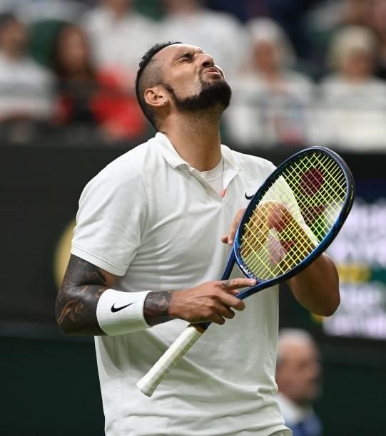 Australia's Nick Kyrgios loses a point to France's Ugo Humbert during their men's singles first round match on the second day of the 2021 Wimbledon...