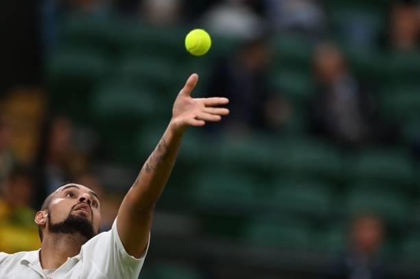 Australia's Nick Kyrgios serves to France's Ugo Humbert during their men's singles first round match on the second day of the 2021 Wimbledon...