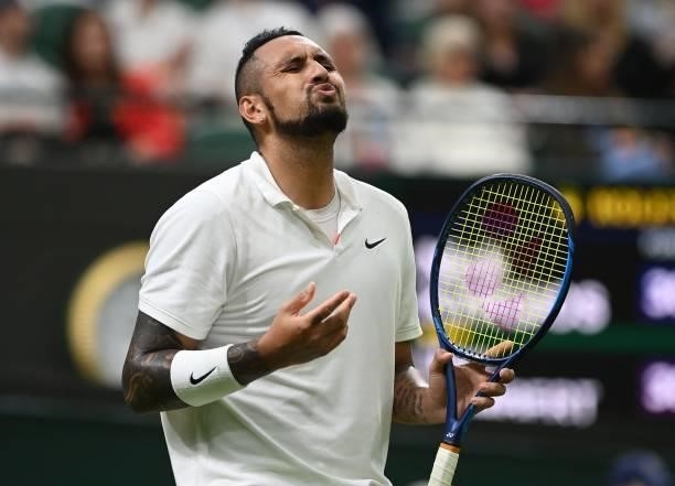 Australia's Nick Kyrgios loses a point to France's Ugo Humbert during their men's singles first round match on the second day of the 2021 Wimbledon...
