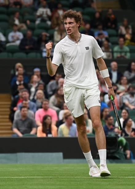 France's Ugo Humbert celebrates a point against Australia's Nick Kyrgios during their men's singles first round match on the second day of the 2021...