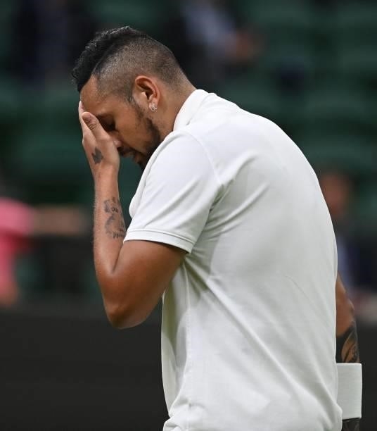 Australia's Nick Kyrgios wipes his face during play against France's Ugo Humbert at their men's singles first round match on the second day of the...