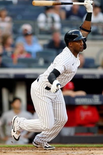 Miguel Andújar of the New York Yankees singles in the second inning during the game between the Los Angeles Angels and the New York Yankees at Yankee...