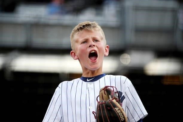 Young fan is seen cheering during the game between the Los Angeles Angels and the New York Yankees at Yankee Stadium on Tuesday, June 29, 2021 in New...