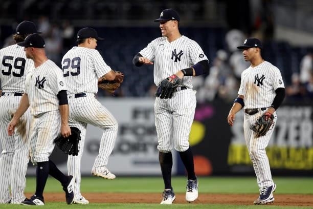 Aaron Judge of the New York Yankees celebrates with teammates after the Yankees defeated the Los Angeles Angels at Yankee Stadium on Tuesday, June...