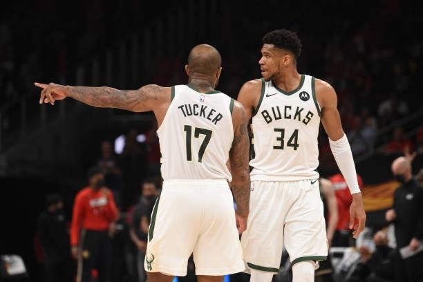 Tucker of the Milwaukee Bucks and Giannis Antetokounmpo of the Milwaukee Bucks talk during Game 4 of the Eastern Conference Finals of the 2021 NBA...