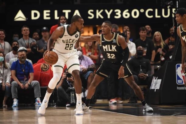 Khris Middleton of the Milwaukee Bucks handles the ball against Kris Dunn of the Atlanta Hawks during Game 4 of the Eastern Conference Finals of the...