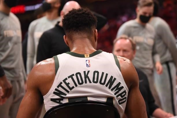 Giannis Antetokounmpo of the Milwaukee Bucks looks on during a huddle during Game 4 of the Eastern Conference Finals of the 2021 NBA Playoffs on June...