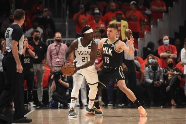 Jrue Holiday of the Milwaukee Bucks handles the ball against Bogdan Bogdanovic of the Atlanta Hawks during Game 4 of the Eastern Conference Finals of...