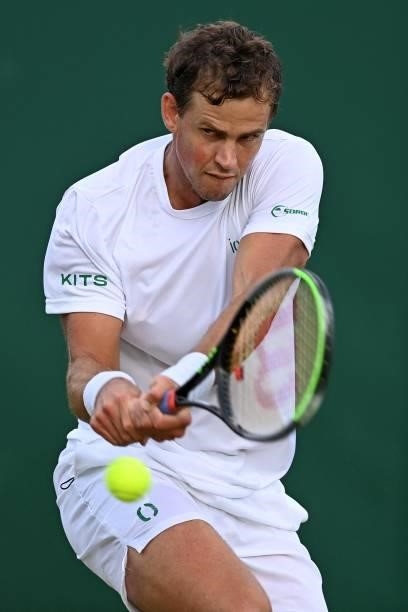 Canada's Vasek Pospisil returns against US player Frances Tiafoe during his men's singles second round match on the third day of the 2021 Wimbledon...