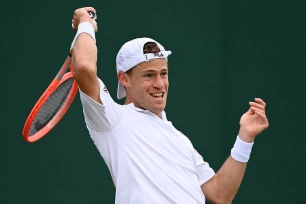 Argentina's Diego Schwartzman returns against Britain's Liam Broady during their men's singles second round match on the third day of the 2021...
