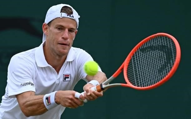 Argentina's Diego Schwartzman returns against Britain's Liam Broady during their men's singles second round match on the third day of the 2021...