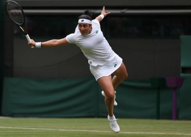 Tunisia's Ons Jabeur returns against US player Venus Williams during their women's singles second round match on the third day of the 2021 Wimbledon...