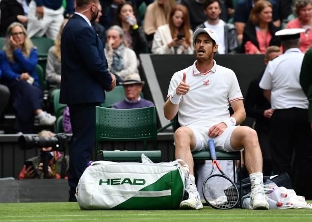 Britain's Andy Murray signals to his bench during his match against Germany's Oscar Otte during their men's singles second round match on the third...