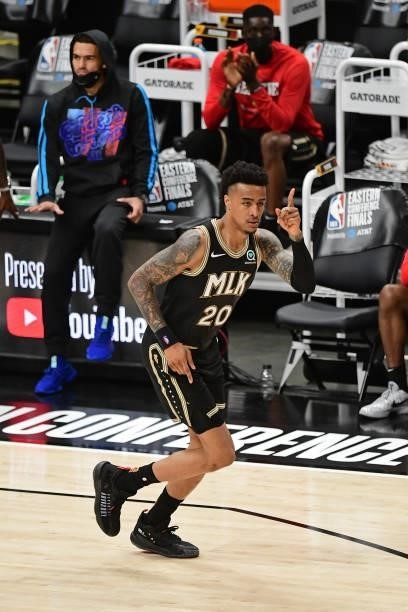 JuNE 29: John Collins of the Atlanta Hawks celebrates during Game 4 of the Eastern Conference Finals of the 2021 NBA Playoffs on June 29, 2021 at...
