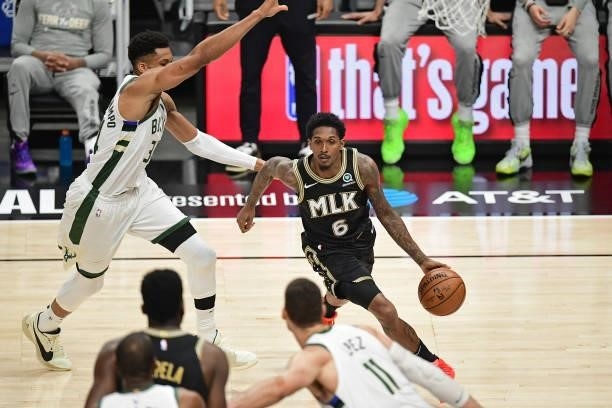 JuNE 29: Lou Williams of the Atlanta Hawks dribbles the ball against the Milwaukee Bucks during Game 4 of the Eastern Conference Finals of the 2021...