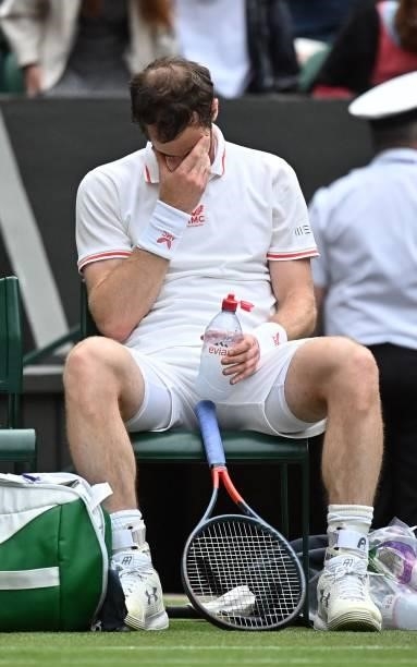Britain's Andy Murray takes a break during play against Germany's Oscar Otte in their men's singles second round match on the third day of the 2021...