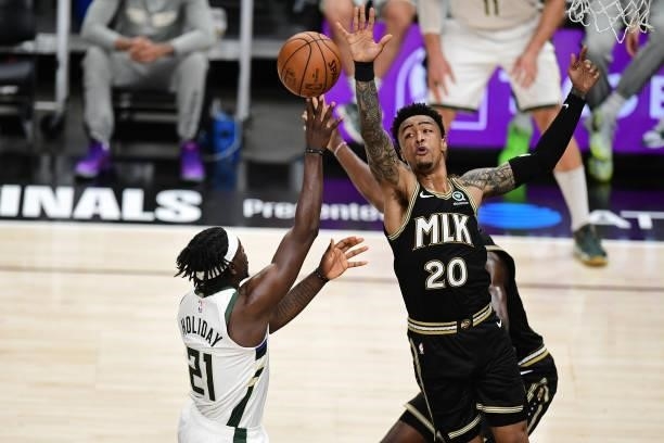 JuNE 29: John Collins of the Atlanta Hawks blocks the ball against the Milwaukee Bucks during Game 4 of the Eastern Conference Finals of the 2021 NBA...