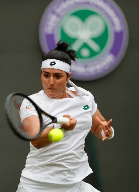 Tunisia's Ons Jabeur returns against US player Venus Williams during their women's singles second round match on the third day of the 2021 Wimbledon...