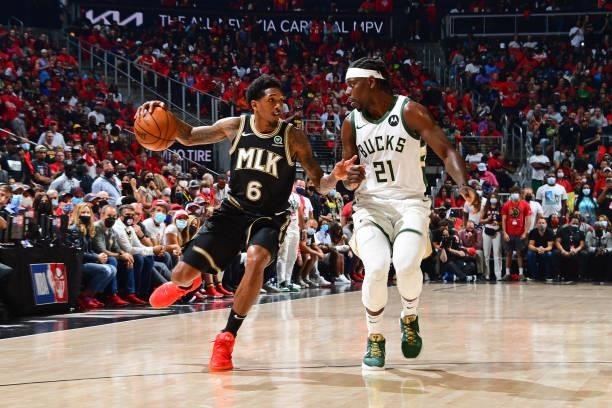 Jrue Holiday of the Milwaukee Bucks plays defense on Lou Williams of the Atlanta Hawks during Game 4 of the Eastern Conference Finals of the 2021 NBA...