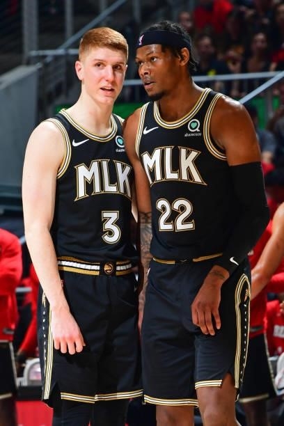 Kevin Huerter talks with Cam Reddish of the Atlanta Hawks during Game 4 of the Eastern Conference Finals of the 2021 NBA Playoffs on June 29, 2021 at...