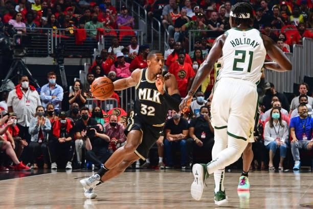 Kris Dunn of the Atlanta Hawks dribbles the ball against the Milwaukee Bucks during Game 4 of the Eastern Conference Finals of the 2021 NBA Playoffs...