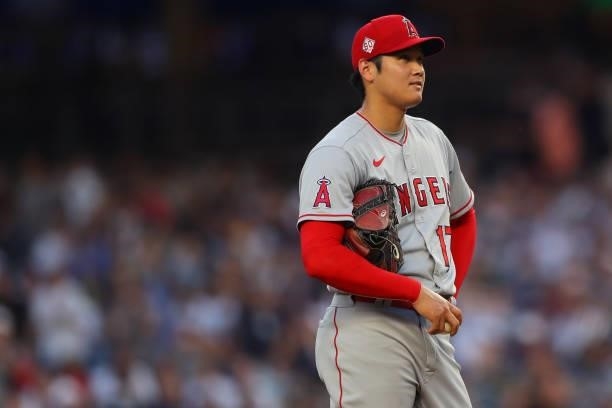 Shohei Ohtani of the Los Angeles Angels reacts during the game between the Los Angeles Angels and the New York Yankees at Yankee Stadium on...