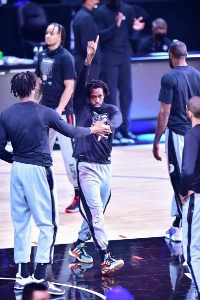 Patrick Beverley of the LA Clippers high fives Daniel Oturu of the LA Clippers before the game against the Phoenix Suns during Game 6 of the Western...