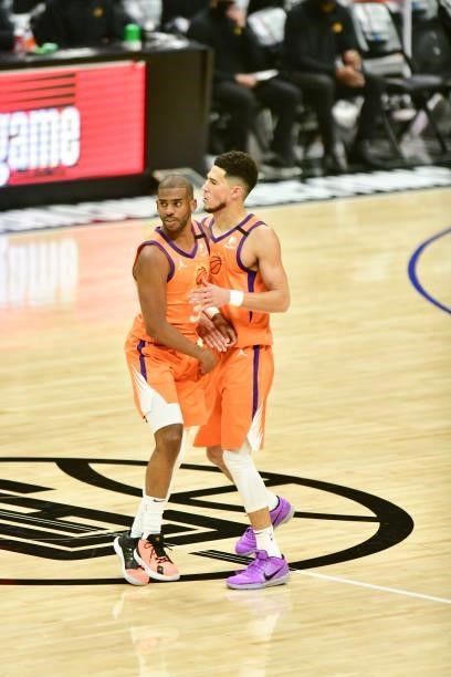 Chris Paul of the Phoenix Suns high fives Devin Booker of the Phoenix Suns during the game against the LA Clippers during Game 6 of the Western...