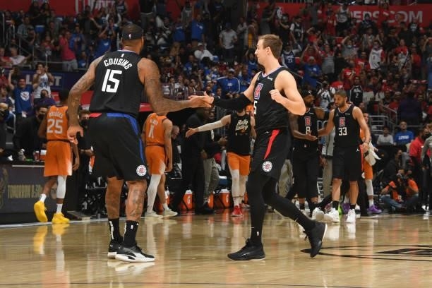DeMarcus Cousins of the LA Clippers high fives Luke Kennard of the LA Clippers during Game 6 of the Western Conference Finals of the 2021 NBA...