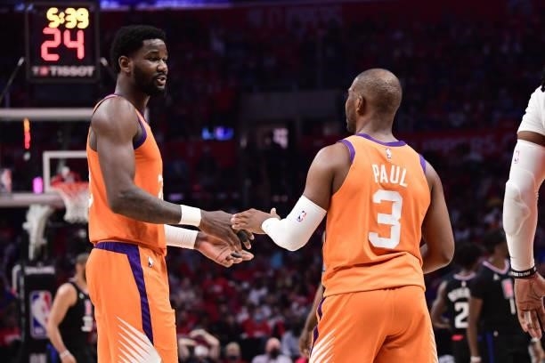 Deandre Ayton talks with Chris Paul of the Phoenix Suns during Game 6 of the Western Conference Finals of the 2021 NBA Playoffs on June 30, 2021 at...