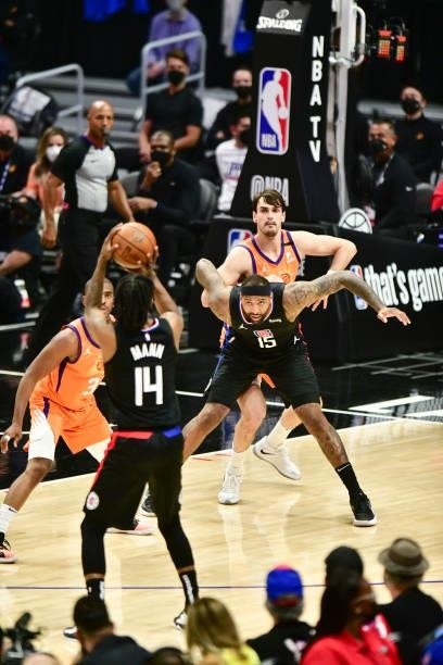DeMarcus Cousins of the LA Clippers and Dario Saric of the Phoenix Suns fight for position during Game 6 of the Western Conference Finals of the 2021...