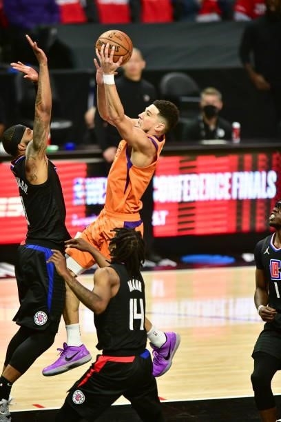 Devin Booker of the Phoenix Suns drives to the basket during the game against the LA Clippers during Game 6 of the Western Conference Finals of the...