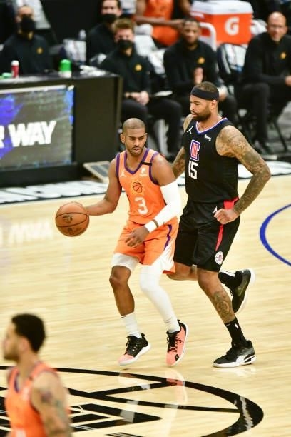 Chris Paul of the Phoenix Suns handles the ball as DeMarcus Cousins of the LA Clippers plays defense during Game 6 of the Western Conference Finals...